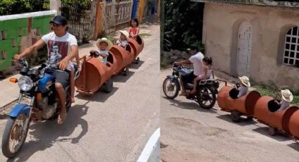 Por parques cerrados, un papá hace trenecito con barriles para pasear a sus hijos