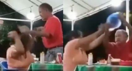 Hombre agrede a su pareja en un puesto de tacos; le aventó comida y salsa | VIDEO