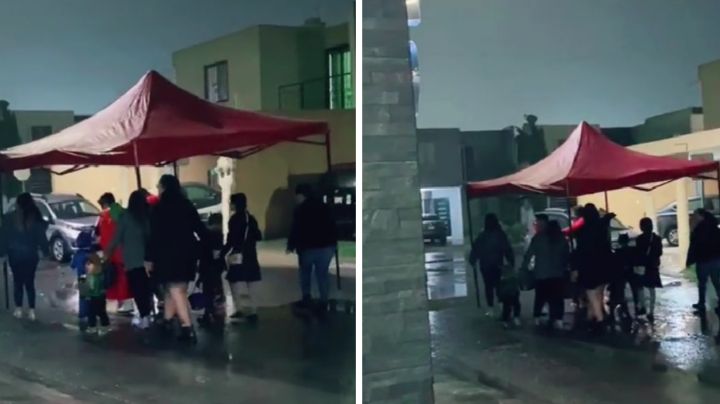 Pese a lluvia, mamás salen con lona para pedir calaverita con sus hijos | VIDEO