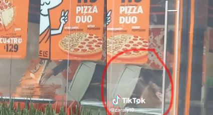 Empleado de Little Caesars saca cajas de la basura para volverlas a usar | VIDEO