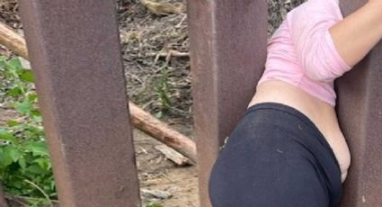 Mujer queda atrapada al tratar de cruzar el muro fronterizo; la abandonan 'coyotes'