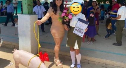 Guapa mujer le regala cerdo a su ahijada en graduación de primaria