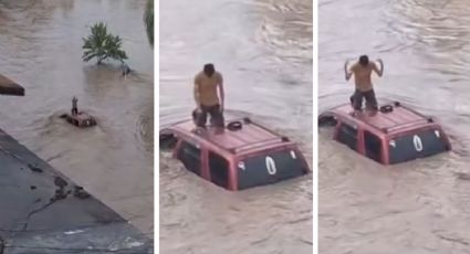 MOMENTO EXACTO en el que joven reza hincado sobre camioneta; quedó atrapado en inundación