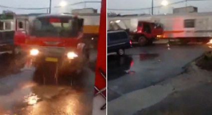 Tren embiste a camión; el conductor salta segundos antes del impacto y se salva de milagro | VIDEO
