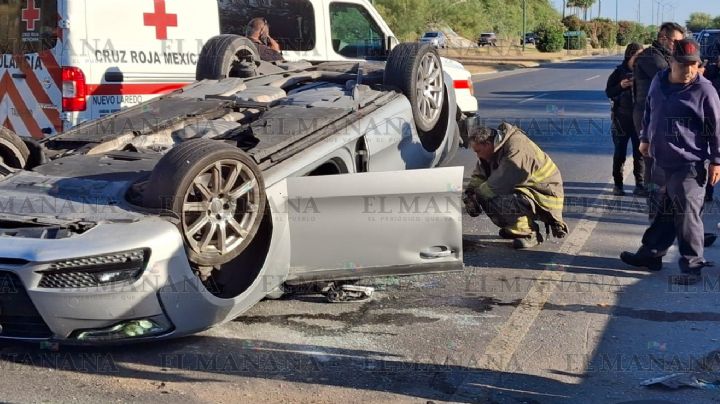 Aparatosa volcadura de Audi en el Bulevar Colosio; joven se salva de morir prensado