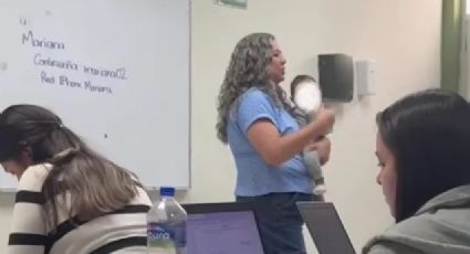 Maestra carga a bebé de su alumna para que termine sus actividades en clase | VIDEO