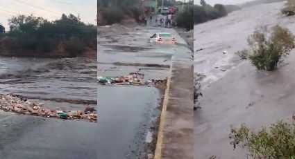 Auto queda varado en desborde del río por intensas lluvias; conductor sobrevive tras ignorar advertencias