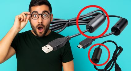 ¿Cuál es la función del cilindro en el cable del cargador y por qué es tan importante?